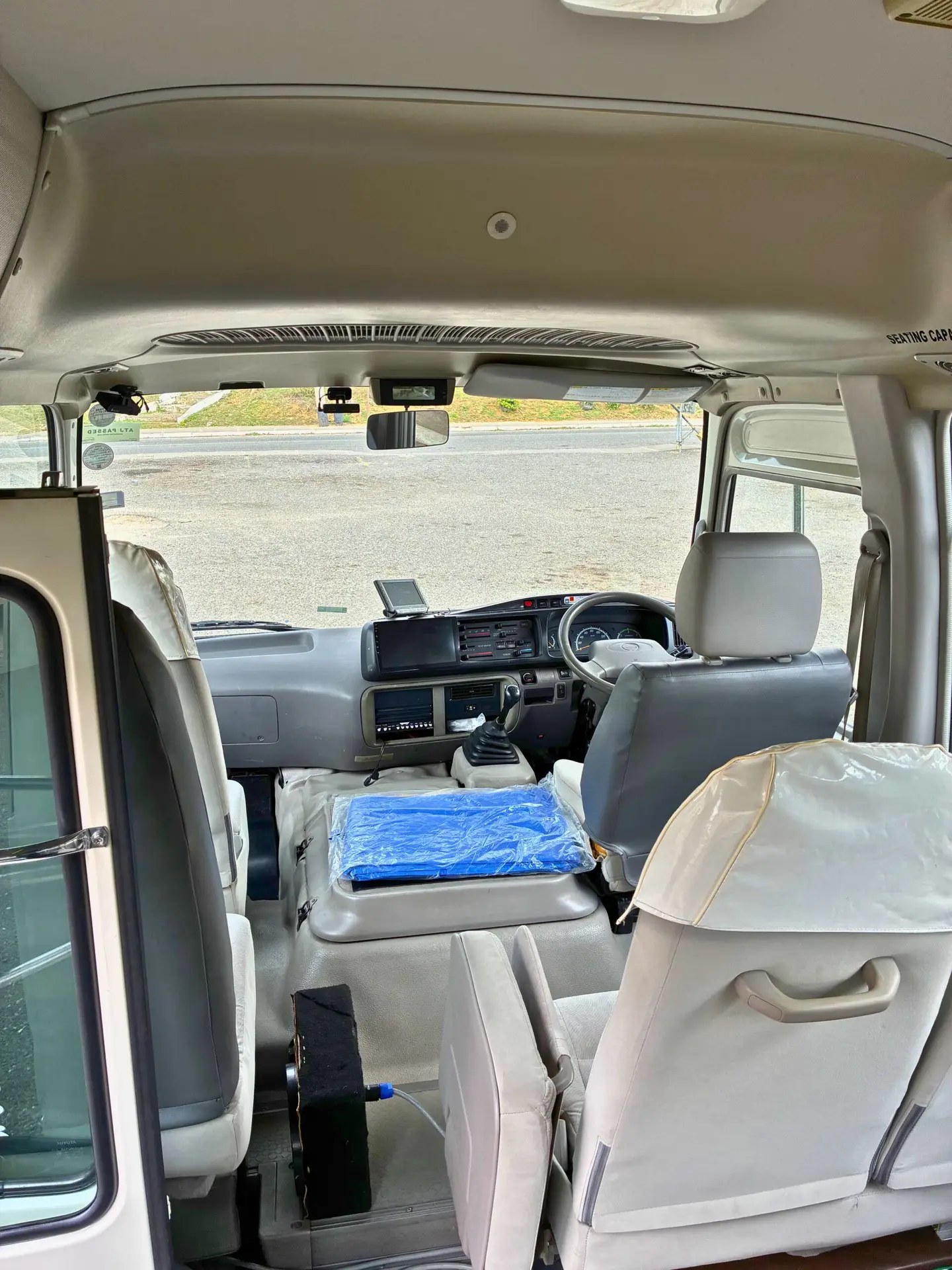Interior seating of Toyota Coaster Group Shuttle