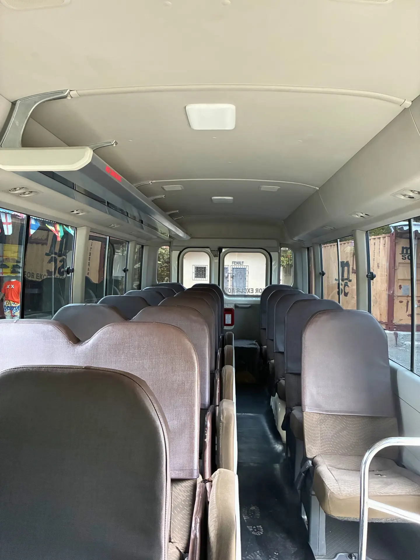Side exterior of Private Charter Toyota Coaster