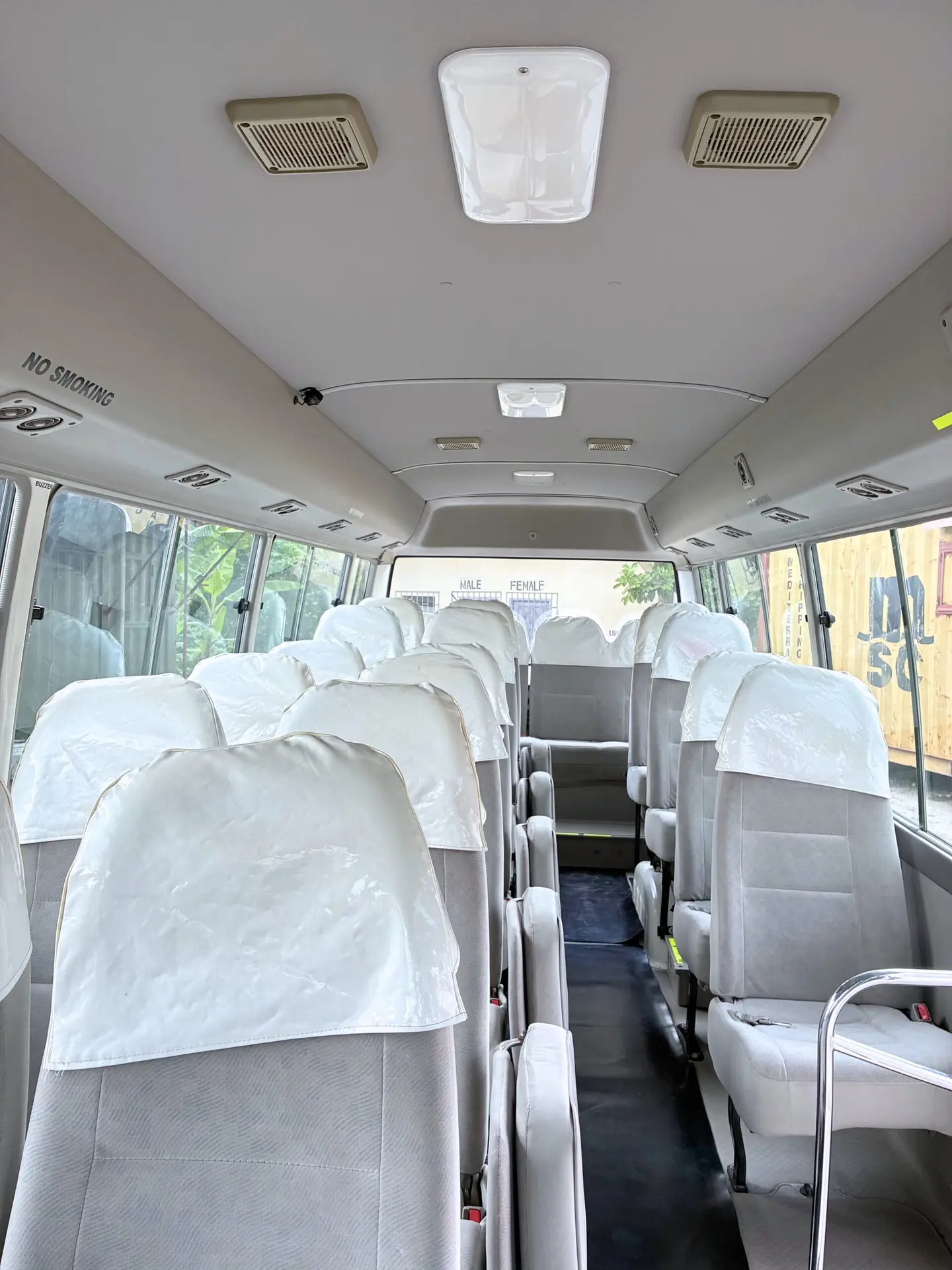 Side exterior of Toyota Coaster Group Shuttle