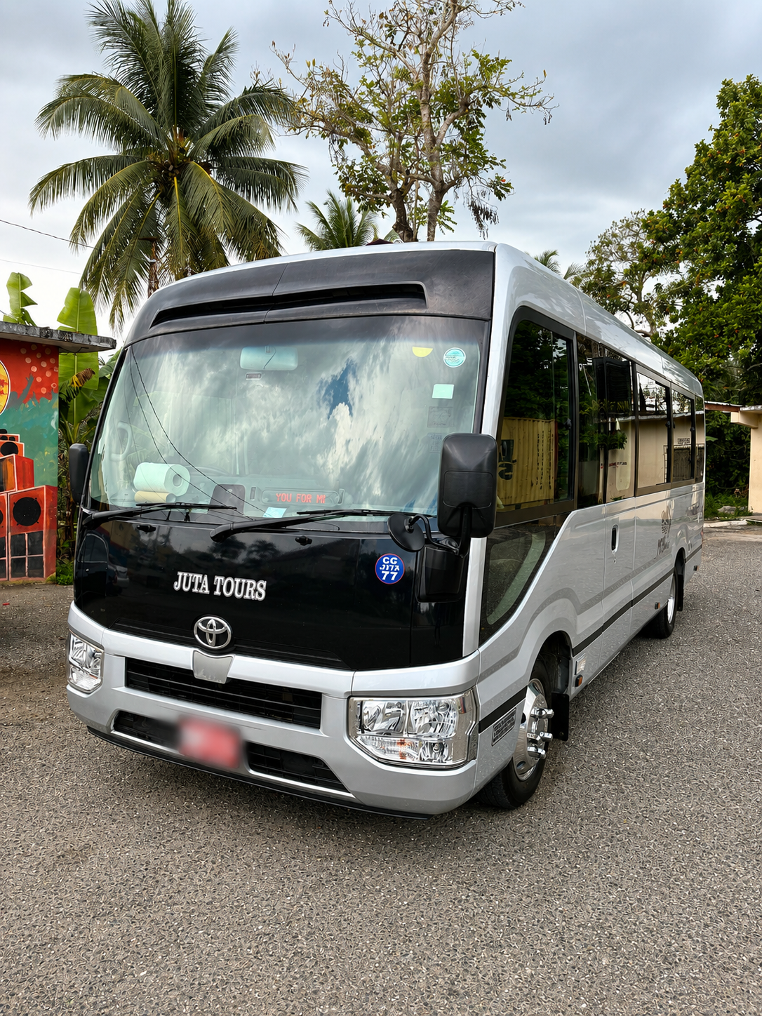 Front exterior of MCR Tours Executive Toyota Coaster