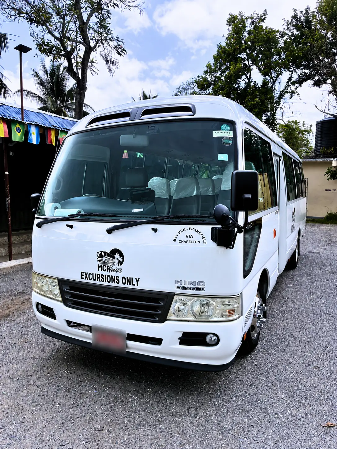 Front exterior of MCR Tours Toyota Coaster Group Shuttle